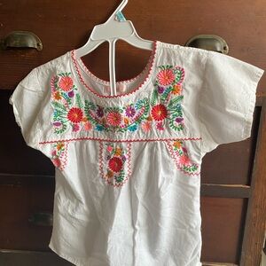 Unik White Top with Red Stitching and Floral Accents